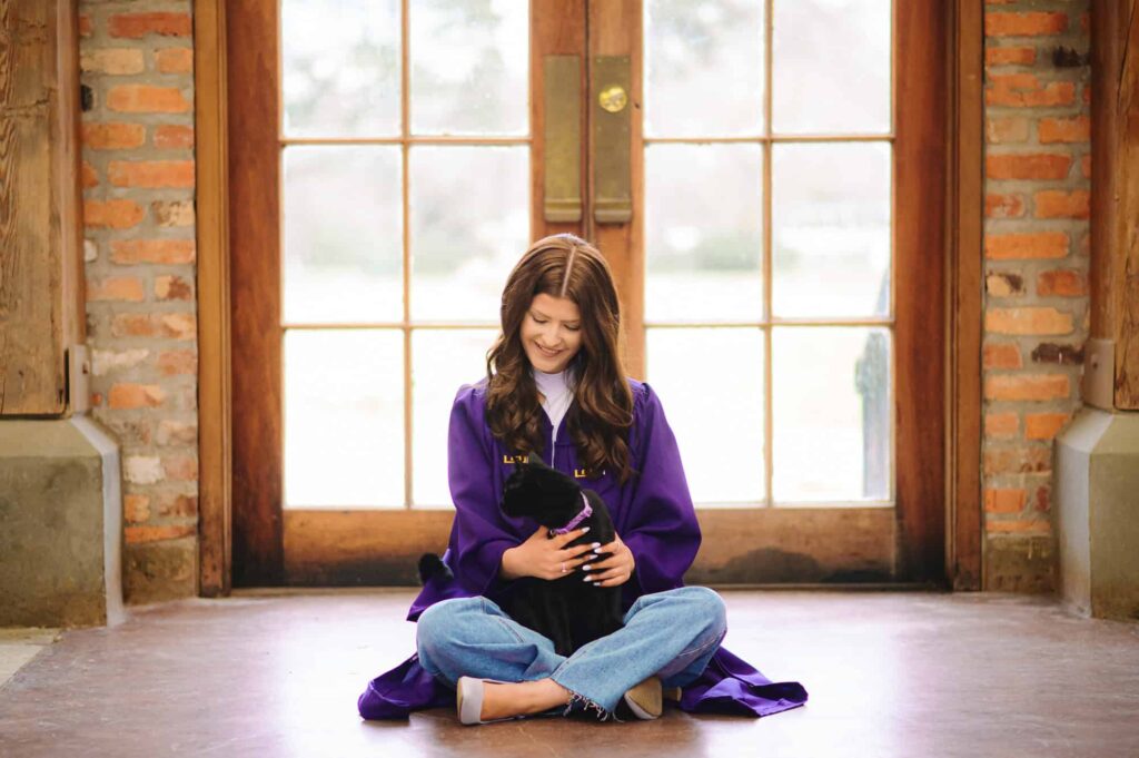 LSU senior holding her cat during senior portraits in Baton Rouge, Louisiana