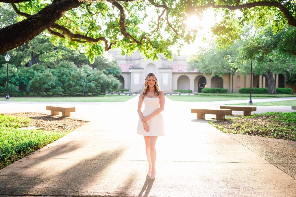 LSU senior poses in the quad during graduation portraits on LSU campus in Baton Rouge, Louisiana