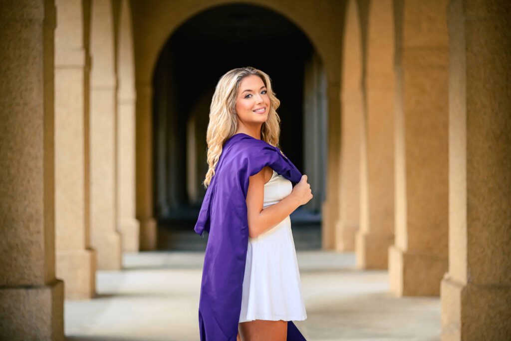 LSU senior poses in the quad during graduation portraits on LSU campus in Baton Rouge, Louisiana