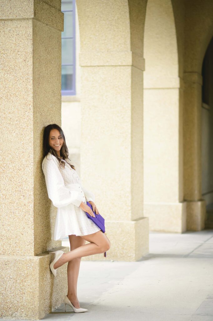 LSU senior poses in the quad during graduation portraits on LSU campus in Baton Rouge, Louisiana
